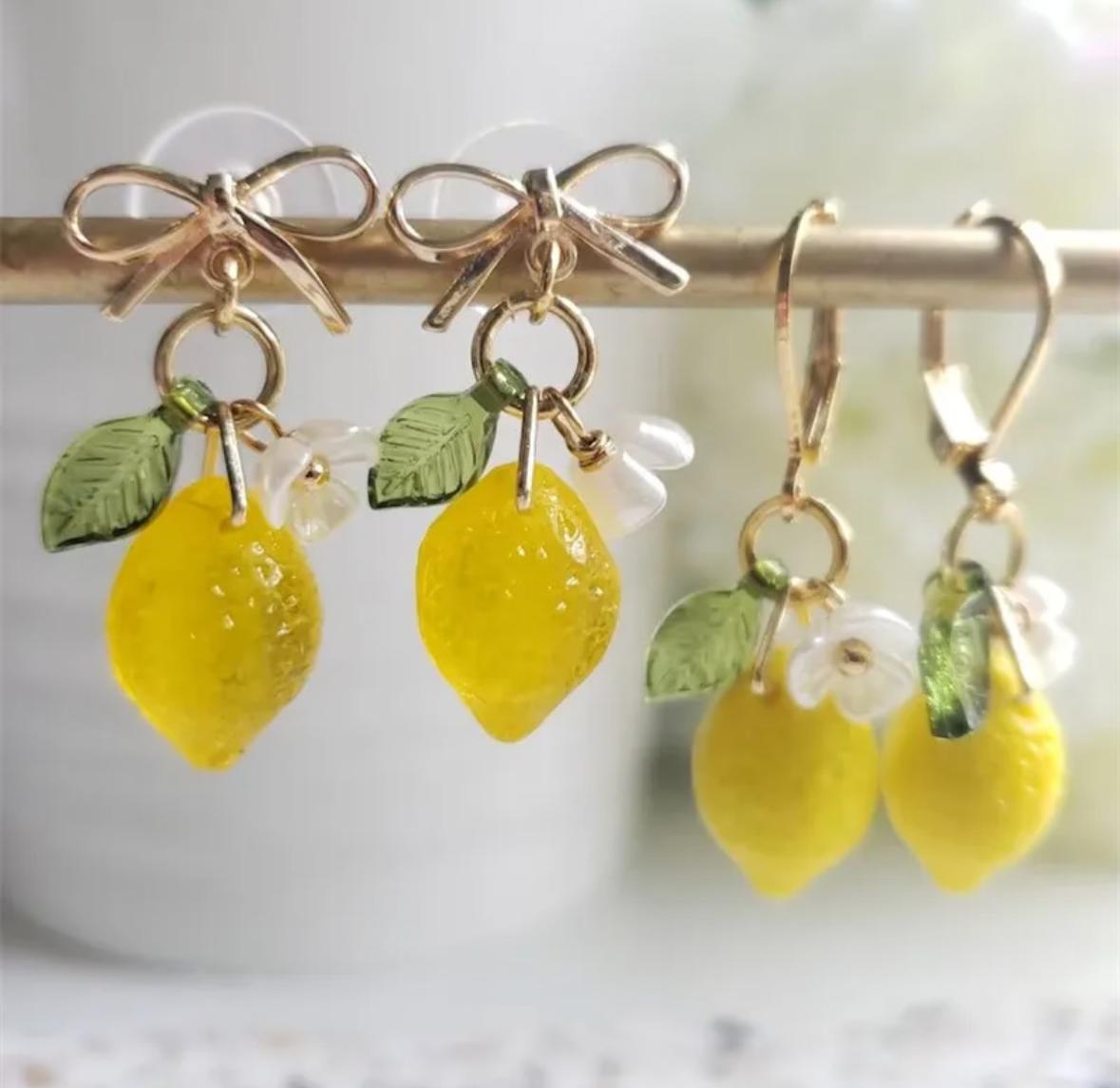 a pair of cute lemon earings
