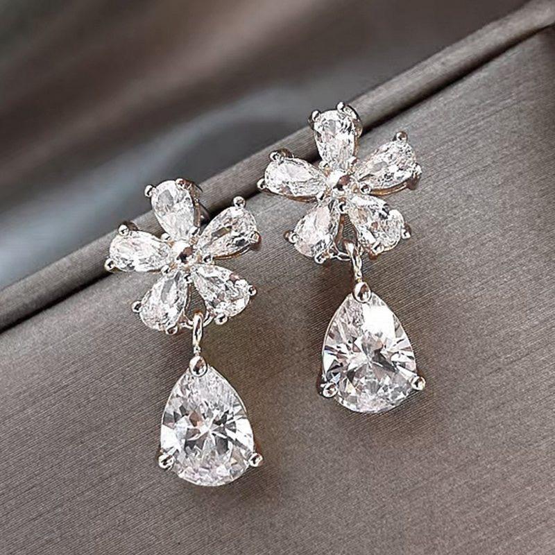 Korean Silver-Plated American Diamond Studded Floral Shaped Drop Earrings