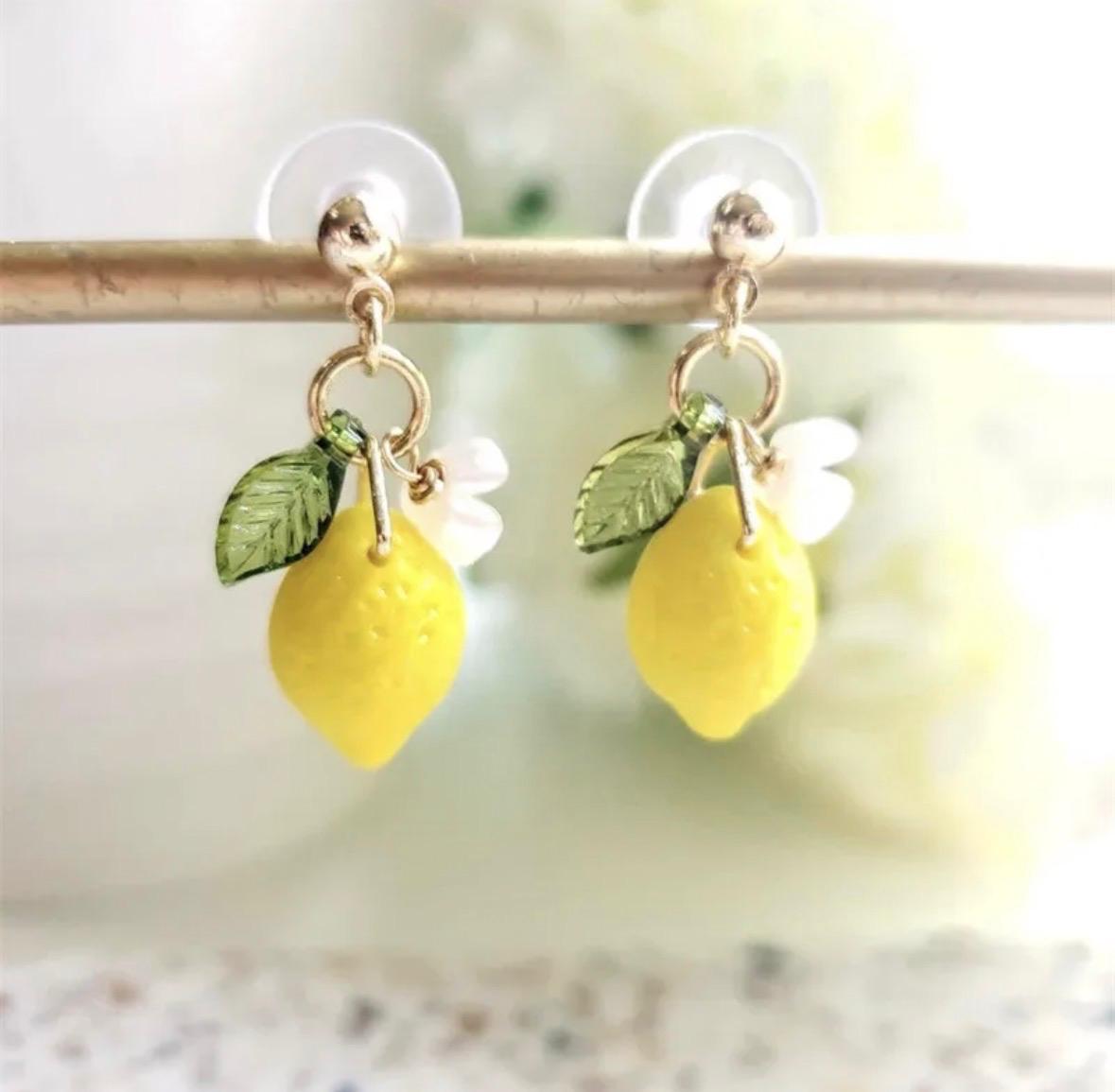 a pair of cute lemon earings